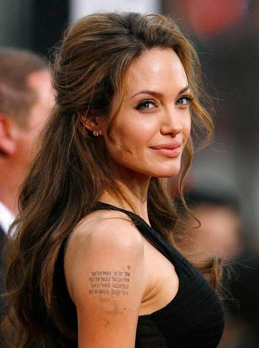 Angelina Jolie's Daily Hairstyle: Long Casual With Top Layer Within Long Hairstyles Pinned Back (View 2 of 15)
