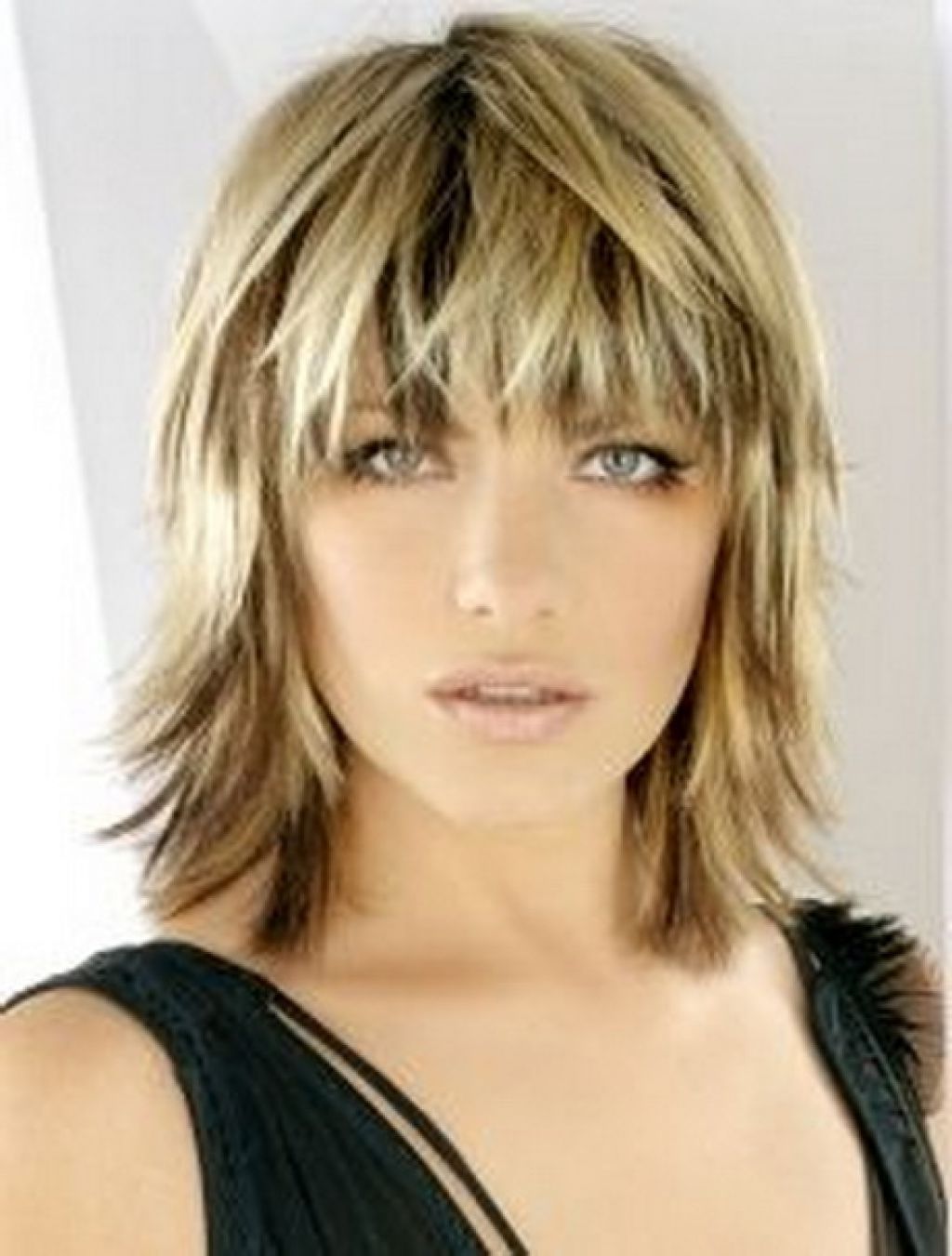 Blonde Medium Length Choppy Shag Haircut With Wispy Bangs And Dark Throughout 2018 Shaggy Wispy Hairstyles (View 1 of 15)