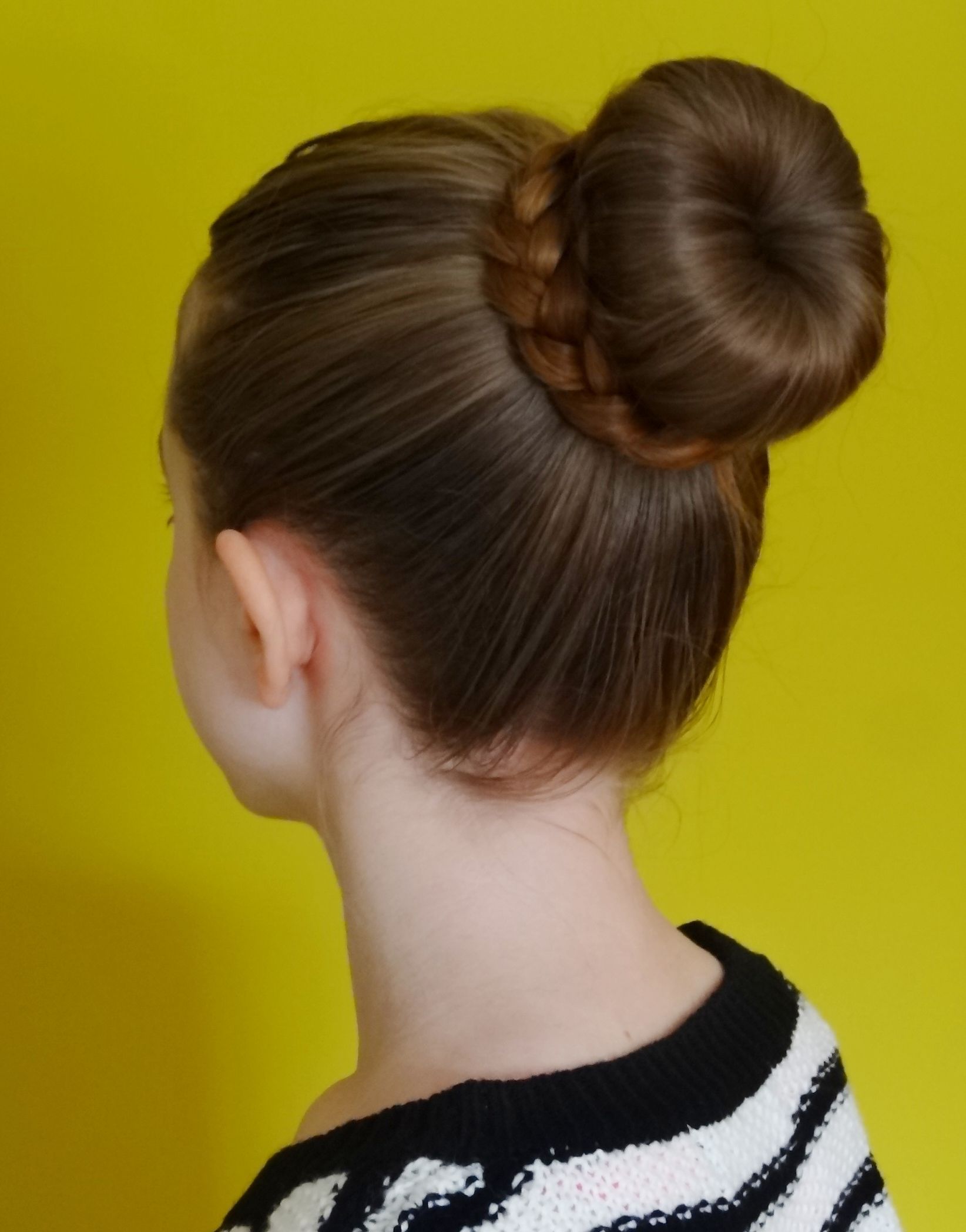 Well Liked Donut Bun Hairstyles With Braid Around Pertaining To Bun (hairstyle) – Wikipedia (View 1 of 15)