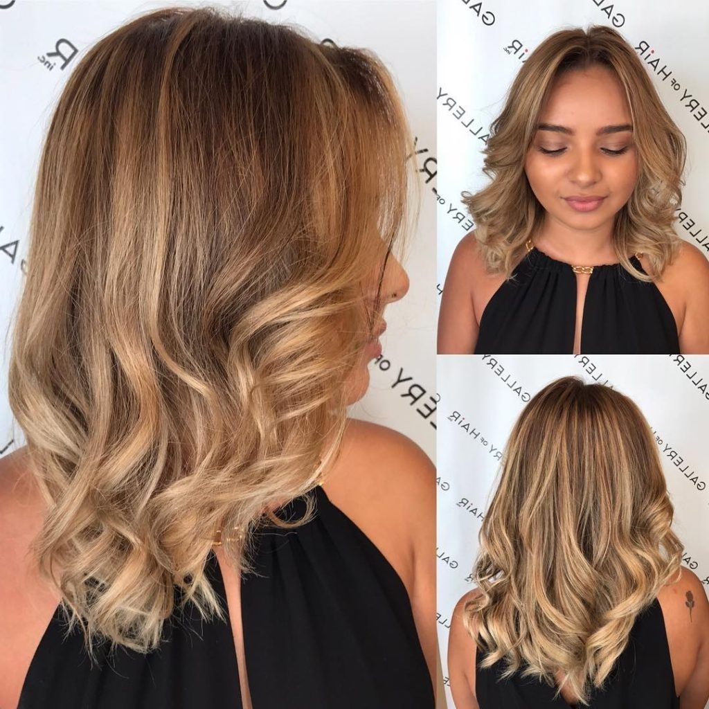 Women's Blonde Sun Kissed Layered Cut With Large Soft Waves And Within Well Known Sun Kissed Blonde Hairstyles With Sweeping Layers (View 1 of 20)