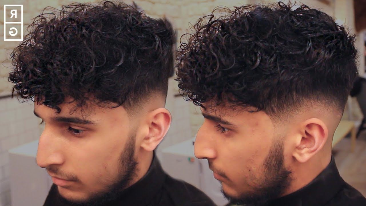 Low Skin Fade Curly Haircut For Men With Disconnected Undercut Regarding Undercut Hairstyles For Curly Hair (Gallery 20 of 20)