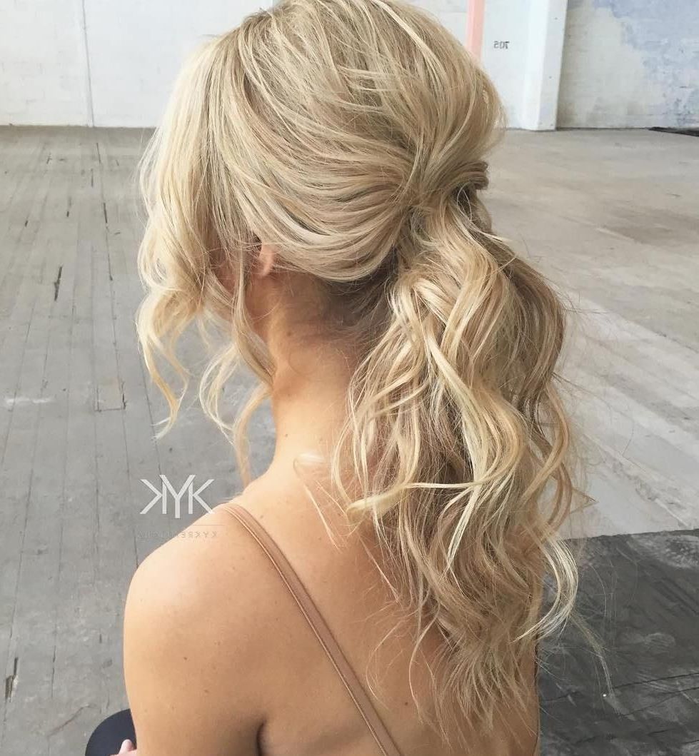 Most Current Wavy Free Flowing Messy Ponytail Hairstyles Pertaining To 30 Eye Catching Ways To Style Curly And Wavy Ponytails (View 2 of 20)