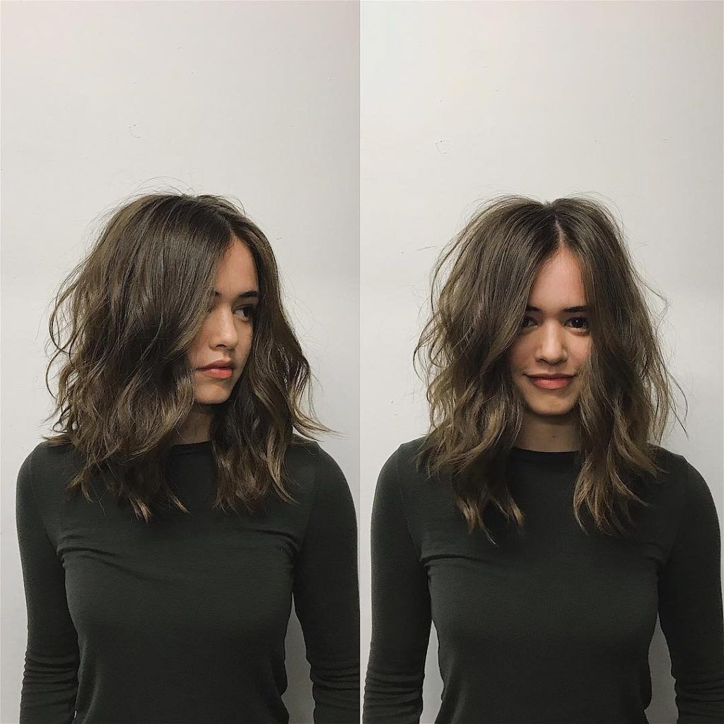 Women's Brunette Layered Cut With Messy Wavy Texture And Center Part Throughout Famous Center Part Medium Hairstyles (View 1 of 20)