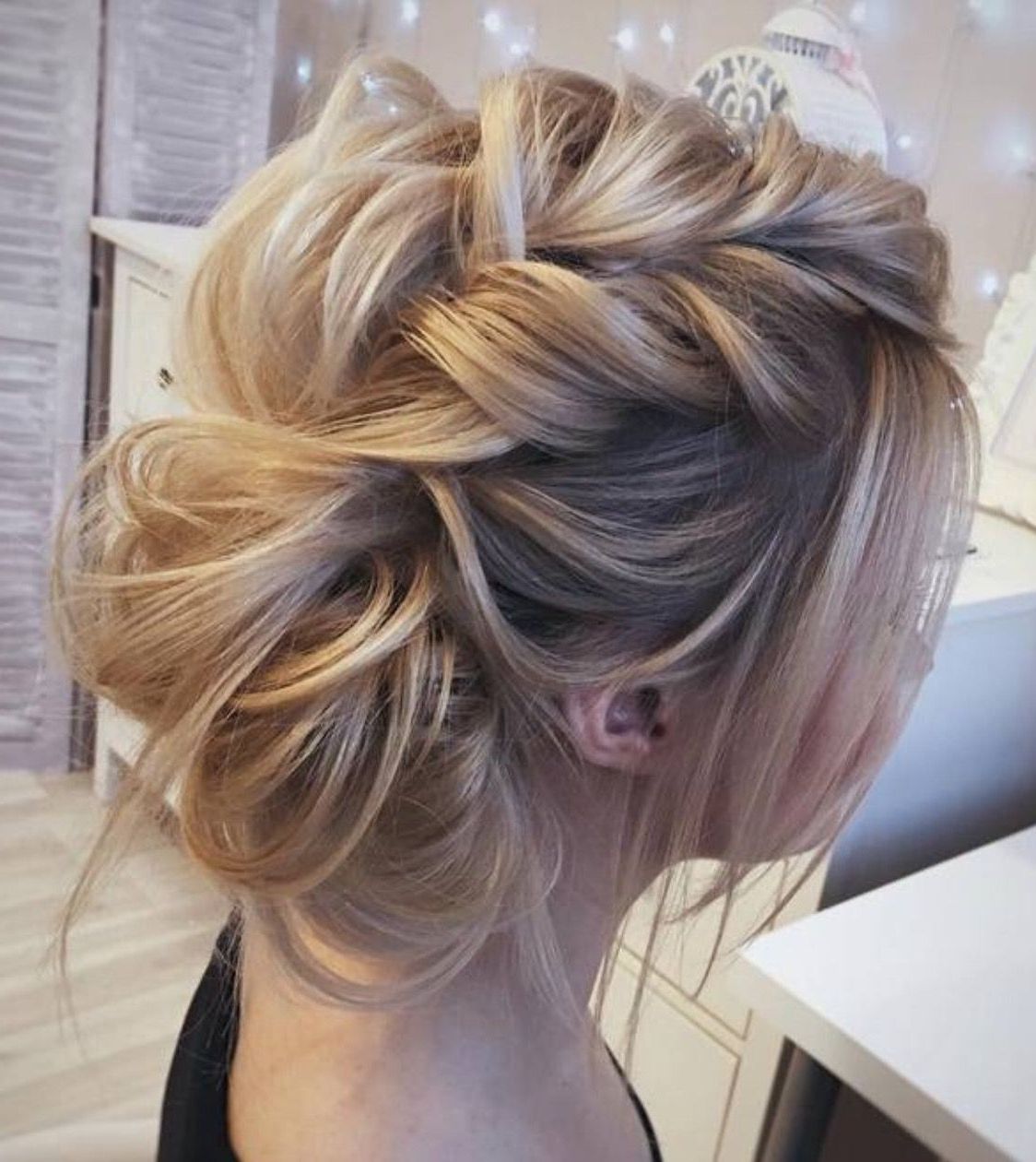 Very Loose Fishtail Braid Pulled Apart Into A Bun With Messy, Wispy With Regard To Most Current Wavy And Wispy Blonde Updo Wedding Hairstyles (View 1 of 20)