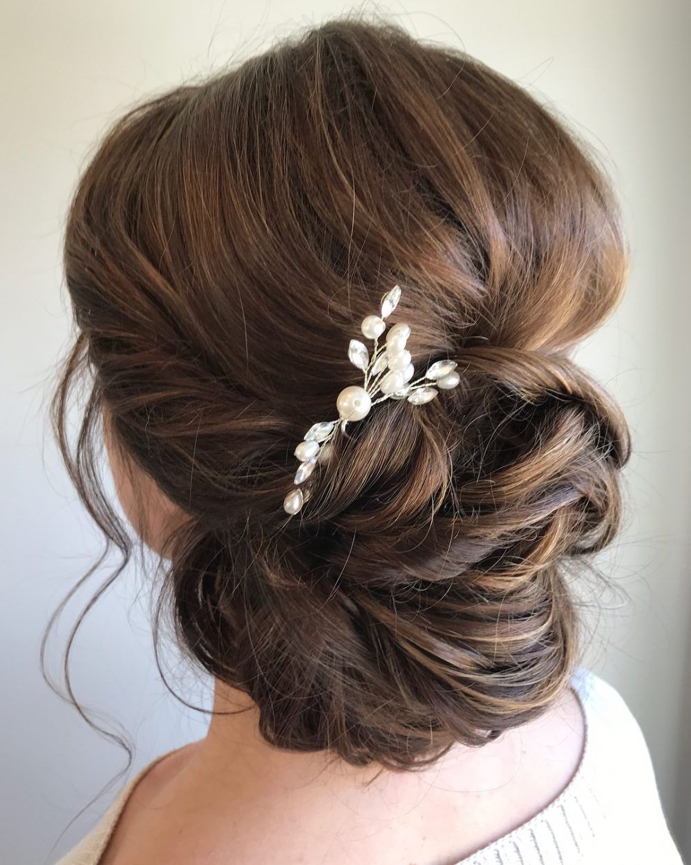 33 Breathtaking Loose Updos That Are Trendy For 2019 Within Most Recent Low Petal Like Bun Prom Hairstyles (View 7 of 20)