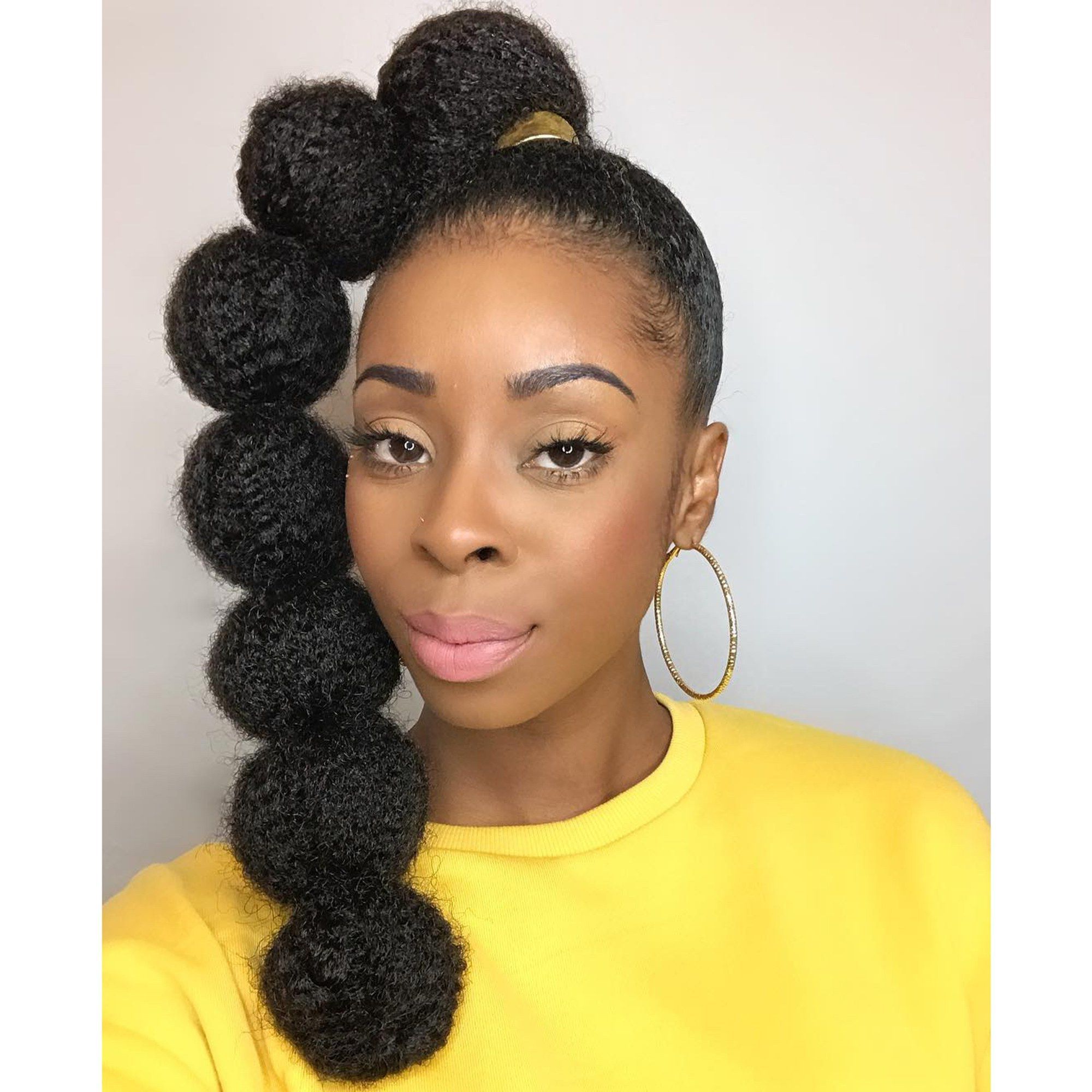Afro Puff Bubble Ponytails Are Trending On Instagram Throughout 2019 Natural Bubble Ponytail Updo Hairstyles (View 1 of 20)