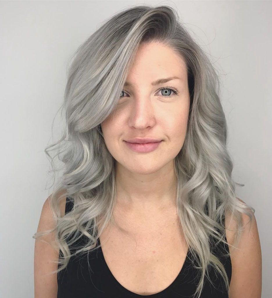 Trendy Long Wavy Hairstyles With Side Swept Bangs With Regard To Wavy Layered Cut With Long Side Swept Bangs And Grey Blend Color (View 17 of 20)