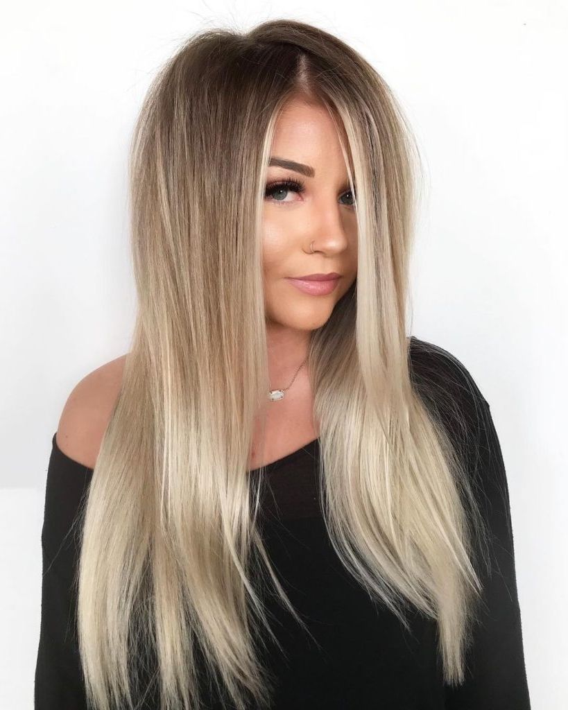 Women's Long Rooted Blonde Hair With Seamless Layers And Intended For Most Up To Date Sleek Straight And Long Layers Hairstyles (View 7 of 20)