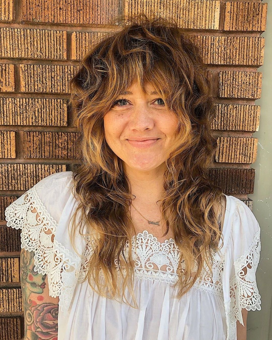 14 Cute Shag Haircut Ideas For Any Length — Shag Hair Trend Inside Long Curly Pixie Haircuts With Subtle Highlights (View 19 of 20)