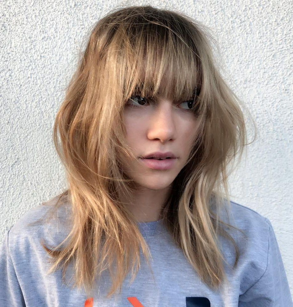 Current Medium Messy Shag Haircuts With Arched Bangs Throughout The Most Instagrammable Hairstyles With Bangs In  (View 6 of 20)