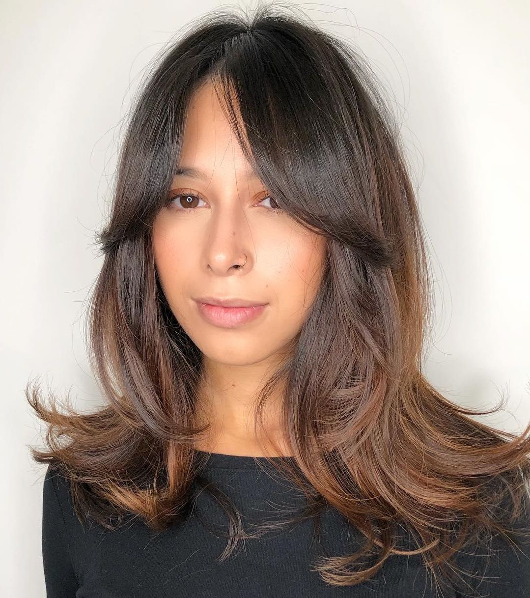 Well Liked Medium To Long Choppy Haircuts With Bangs Within 30 Flattering Hairstyles For Long Faces You'll Want To Try (View 20 of 20)