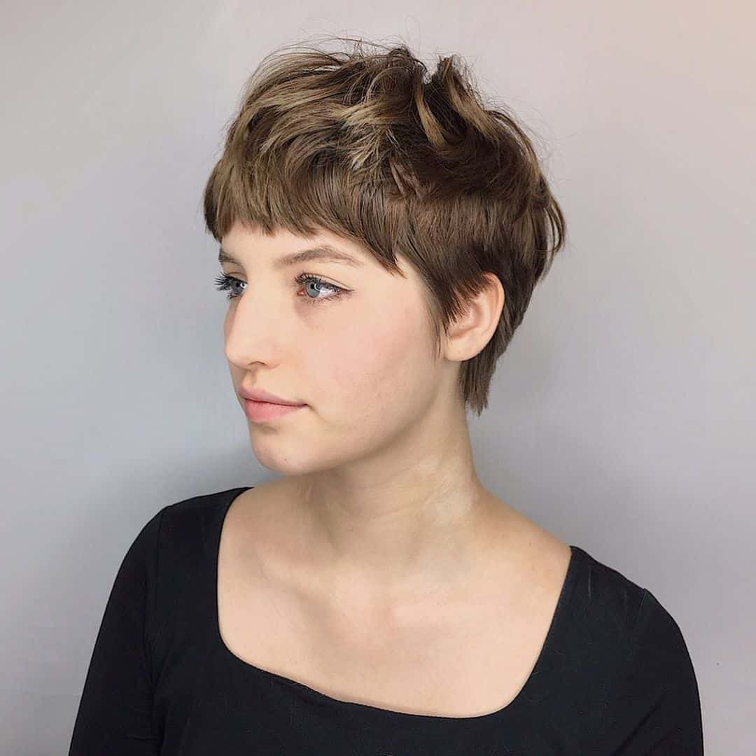 43 Cutest Pixie Cuts With Bangs For A Face Flattering Crop Regarding Side Swept Long Layered Pixie Hairstyles (View 18 of 20)