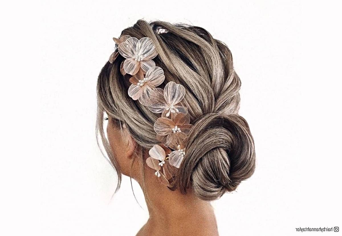 20 Romantic Bun Hairstyles For Prom That Are Easy To Do Pertaining To Most Recently Released Low Flower Bun For Long Hair (View 11 of 15)