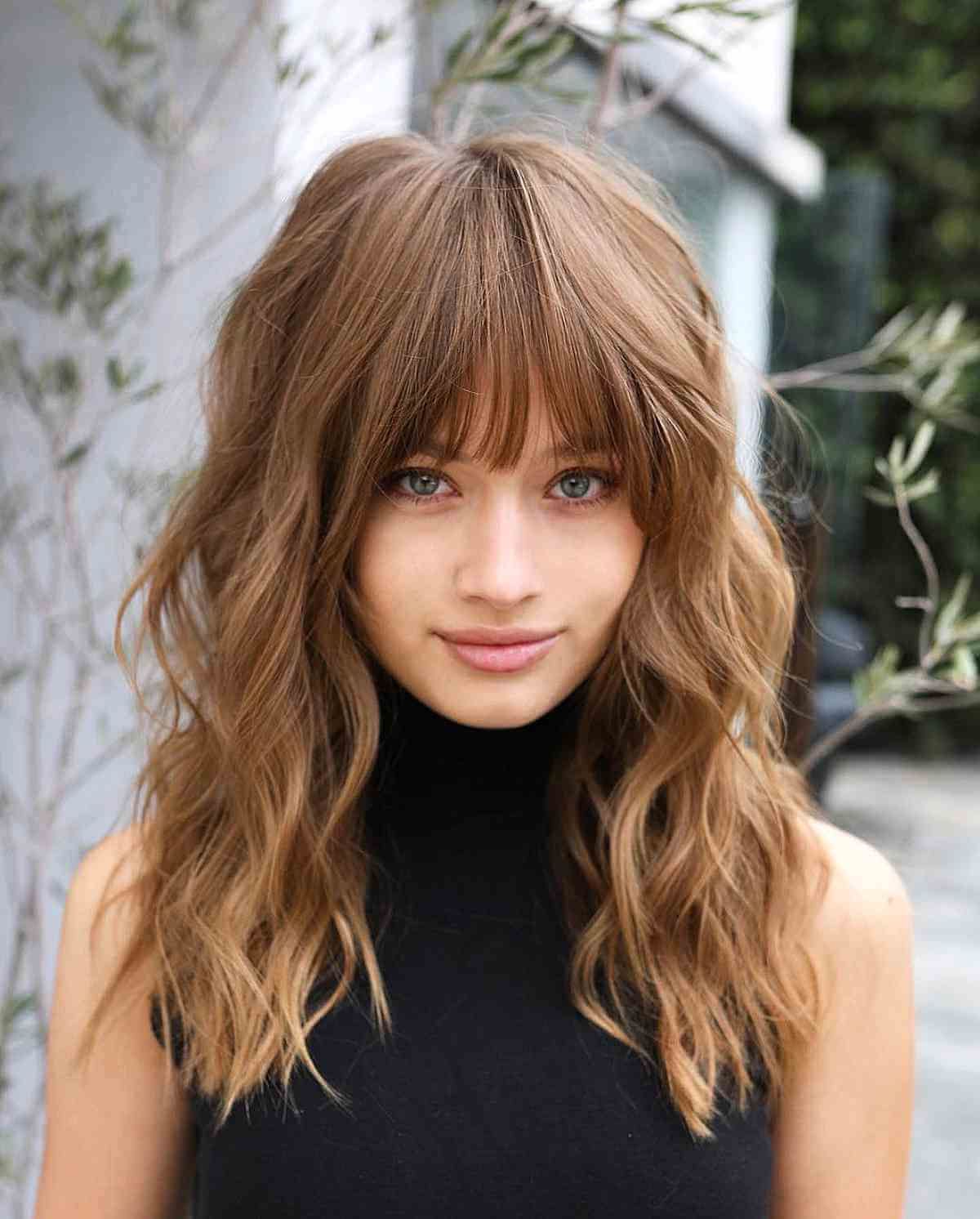 32 Ways To Pair Wavy Hair With Bangs For A Super Flattering Look With Regard To Fashionable Slightly Curly Hair With Bangs (View 5 of 15)