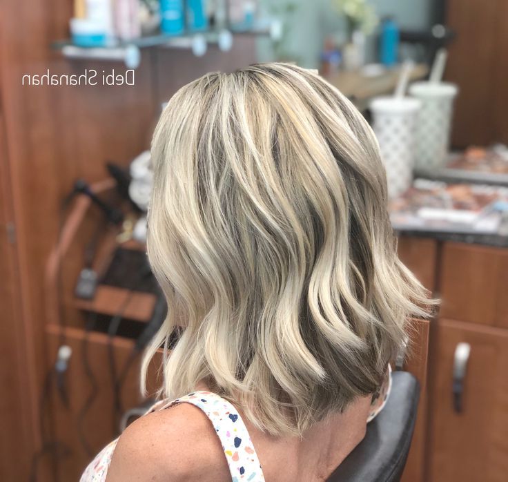 Choppy Lob With Long Layers And Super Light Ash Blonde Highlights (View 2 of 20)