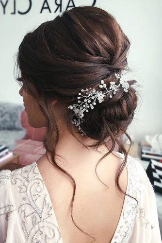 Featured Photo of 15 Inspirations Low Flower Bun for Long Hair