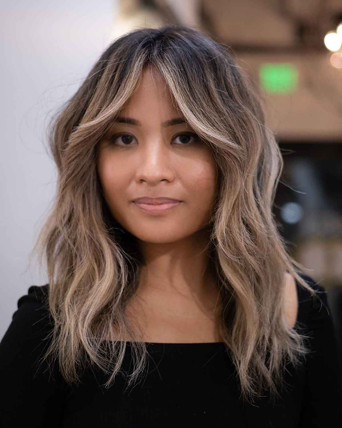Most Current Loose Waves With Unshowy Curtain Bangs Within Pairing Curtain Bangs With Wavy Hair? 22 Best Ways To Do It (View 3 of 15)