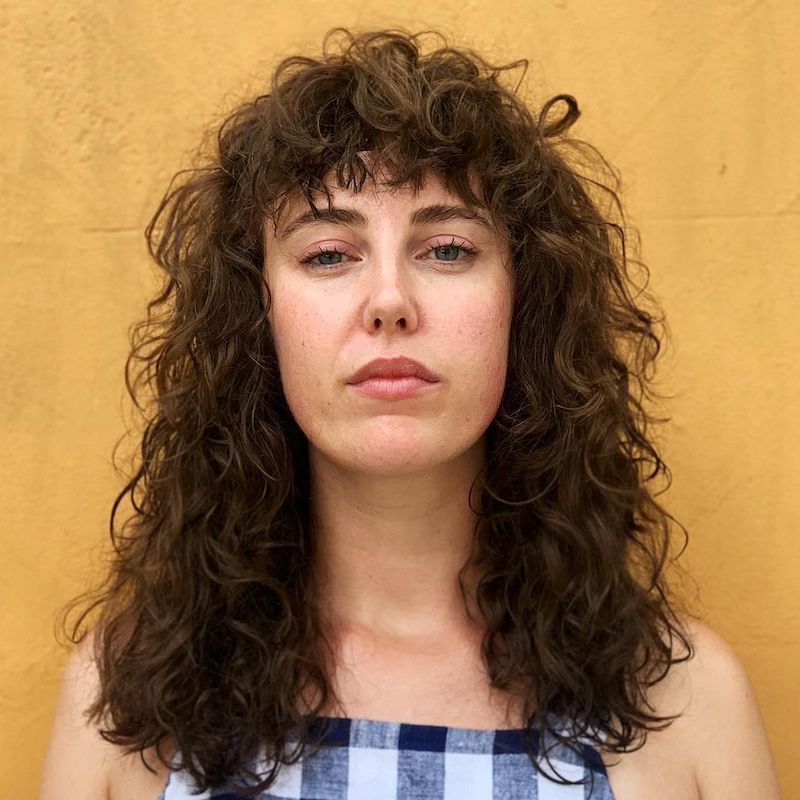 Most Recently Released Slightly Curly Hair With Bangs With 38 Stunning Ways To Rock Curly Hair With Bangs (View 11 of 15)