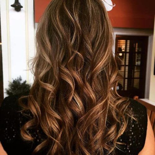 Natural Curls Hairstyles With Caramel Highlights (Photo 7 of 20)