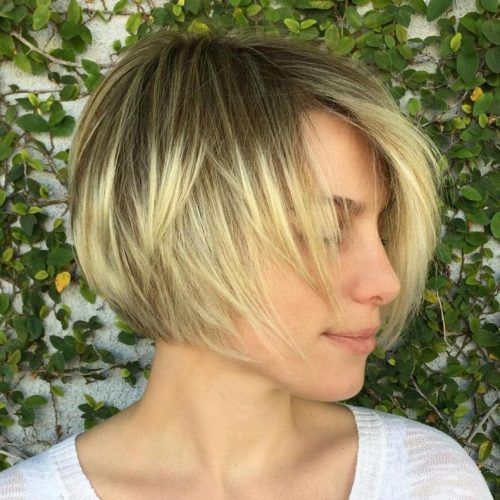 Dynamic Tousled Blonde Bob Hairstyles With Dark Underlayer (Photo 19 of 20)
