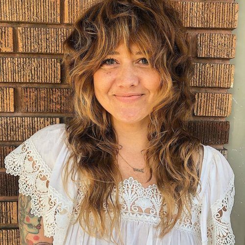 Long Curly Pixie Haircuts With Subtle Highlights (Photo 19 of 20)