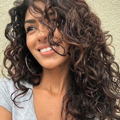 Layered Curly Medium Length Hairstyles (Photo 9 of 20)
