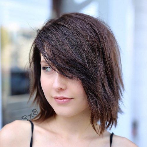 Asymmetrical Parting Feathered Fringe Hairstyles (Photo 9 of 20)