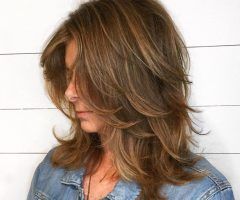 20 Collection of Feminine Feathered Shag Haircuts for Medium Hair