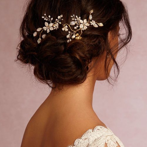 Large Curly Bun Bridal Hairstyles With Beaded Clip (Photo 4 of 20)
