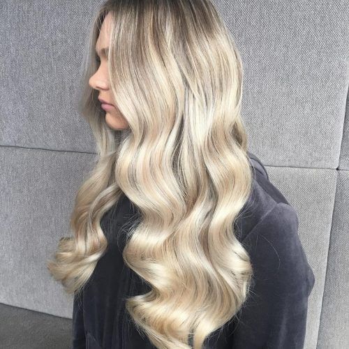 Sun-Kissed Blonde Hairstyles With Sweeping Layers (Photo 8 of 20)