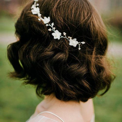Curly Wedding Updos With Flower Barrette Ties (Photo 5 of 20)