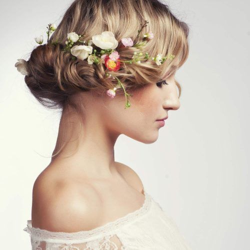 Undone Low Bun Bridal Hairstyles With Floral Headband (Photo 11 of 20)