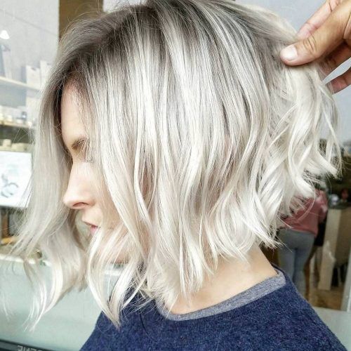 Curly Angled Blonde Bob Hairstyles (Photo 1 of 20)