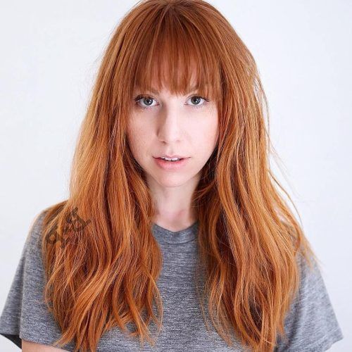 Asymmetrical Copper Feathered Bangs Hairstyles (Photo 7 of 20)
