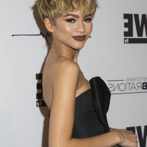 Messy Highlighted Pixie Haircuts With Long Side Bangs (Photo 16 of 20)