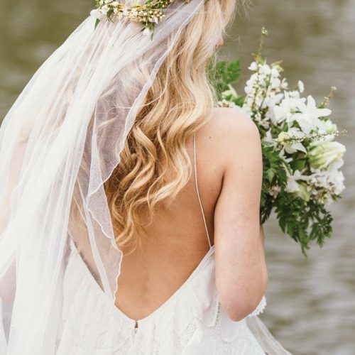 Wedding Hairstyles With Veil And Flower (Photo 9 of 15)