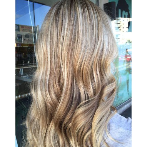 Creamy Blonde Waves With Bangs (Photo 17 of 20)