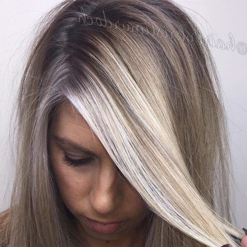 Ashy Blonde Pixie Hairstyles With A Messy Touch (Photo 12 of 20)