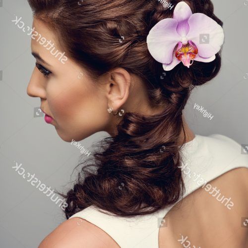 Curly Wedding Hairstyles With An Orchid (Photo 13 of 20)