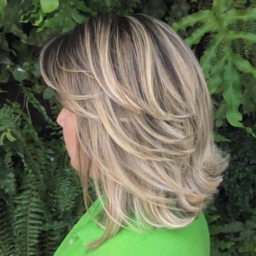 Feathered Cut Blonde Hairstyles With Middle Part (Photo 19 of 20)