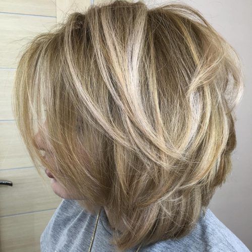 Feathered Cut Blonde Hairstyles With Middle Part (Photo 18 of 20)