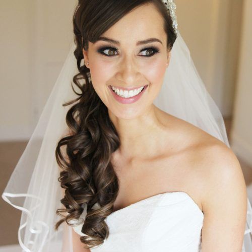 Side Curls Bridal Hairstyles With Tiara And Lace Veil (Photo 2 of 20)