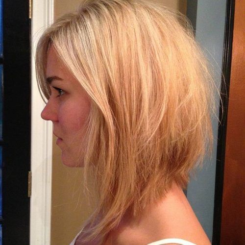 Curly Angled Blonde Bob Hairstyles (Photo 8 of 20)