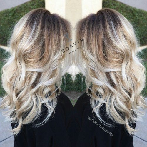 Icy Highlights And Loose Curls Blonde Hairstyles (Photo 18 of 20)