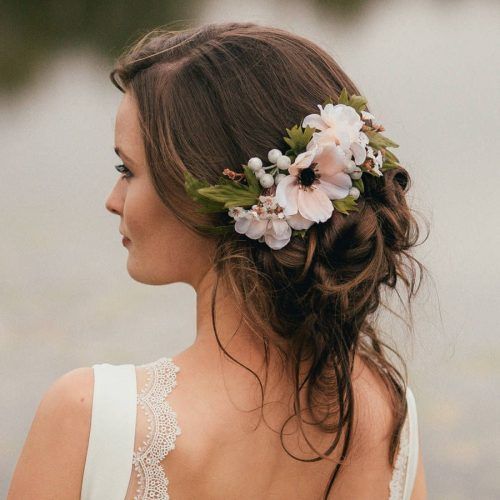 Undone Low Bun Bridal Hairstyles With Floral Headband (Photo 1 of 20)