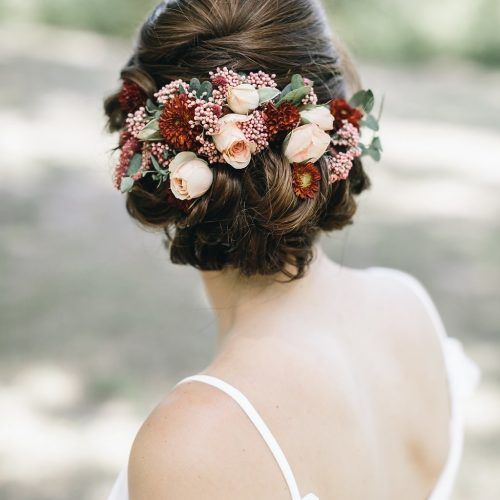 Undone Low Bun Bridal Hairstyles With Floral Headband (Photo 18 of 20)