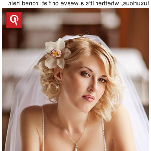 Curly Wedding Hairstyles With An Orchid (Photo 19 of 20)
