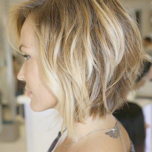 Curly Angled Blonde Bob Hairstyles (Photo 11 of 20)
