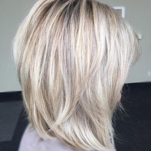 Lovely Golden Blonde Haircuts With Swoopy Layers (Photo 15 of 20)