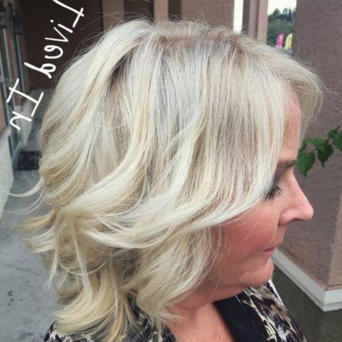 Medium Hairstyles With Perky Feathery Layers (Photo 11 of 20)
